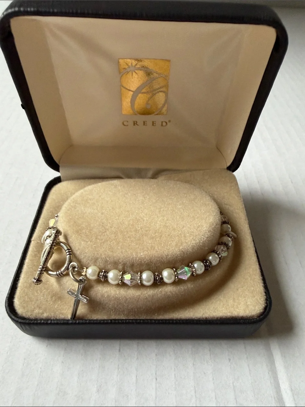Creed Silver and White Pearl Bracelet with Cross Charm and Iridescent Beads